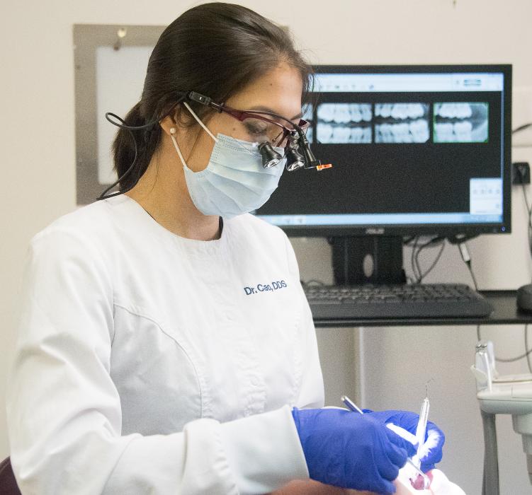 Dr. Cao working on veneers