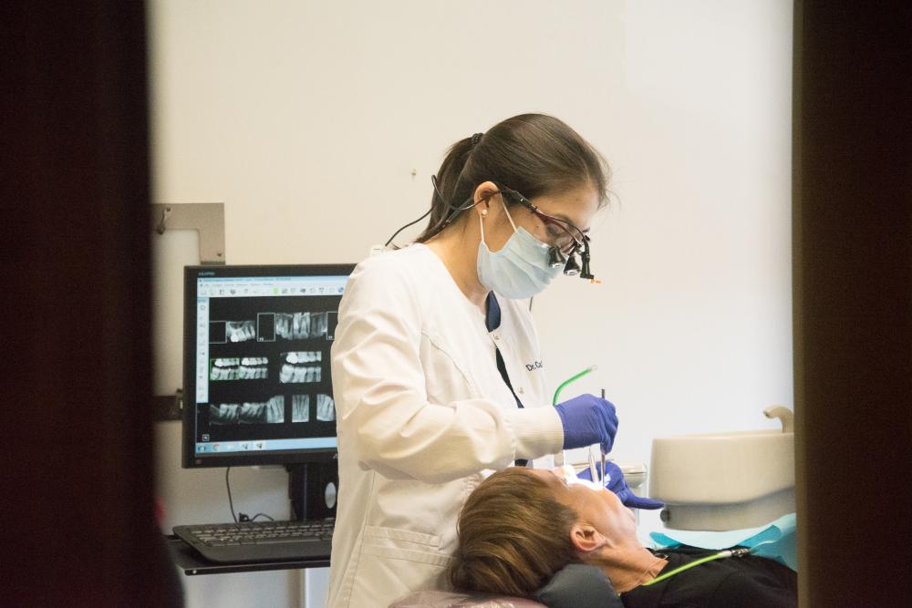 Dr. Cao working on a dental crown