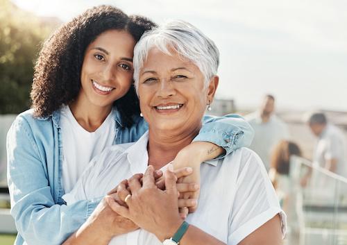 mother and daughter smiling