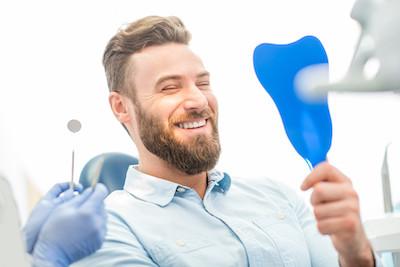 man smiling after teeth whitening